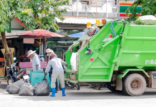 Crews loading a medium van during a flat clearance near Forest Gate station
